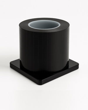 Black COZ Tattoo Barrier Film roll – 1200 perforated sheets 4" x 6" for hygienic surface protection.