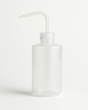 COZ Squeeze Bottle with angled tip – empty and translucent plastic design for tattoo artists.