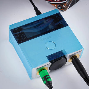 Tattoo machine wrapped in Dragonhawk Barrier Film for hygienic protection.