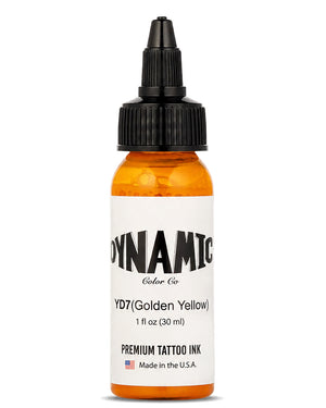 A 1 fl oz (30ml) bottle of Dynamic Color Co. YD7 Golden Yellow premium tattoo ink, featuring a bottle with a white label with black text, and a black plastic dropper cap, set against a plain white background.