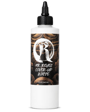 Bottle of Mr. Reyes Cover-Up White tattoo ink with a black cap on a white background
