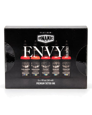 A 5-pack box of Dynamic Platinum Envy Premium Tattoo Ink, featuring five bottles of different colors (Candy Apple Red, Sedona Orange, Pure Red, Scarlet Red, and Crimson Red) in a black presentation box with white and silver branding.