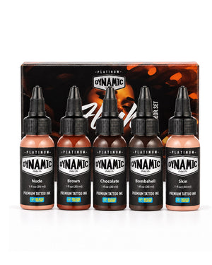 Five bottles of Dynamic Platinum Flesh tattoo ink in a shade set, displayed in front of their branded retail box. The bottles contain shades of nude, brown, chocolate, bombshell, and skin tone, all with black caps and black labels. Each bottle is 1 fl oz (30 ml)