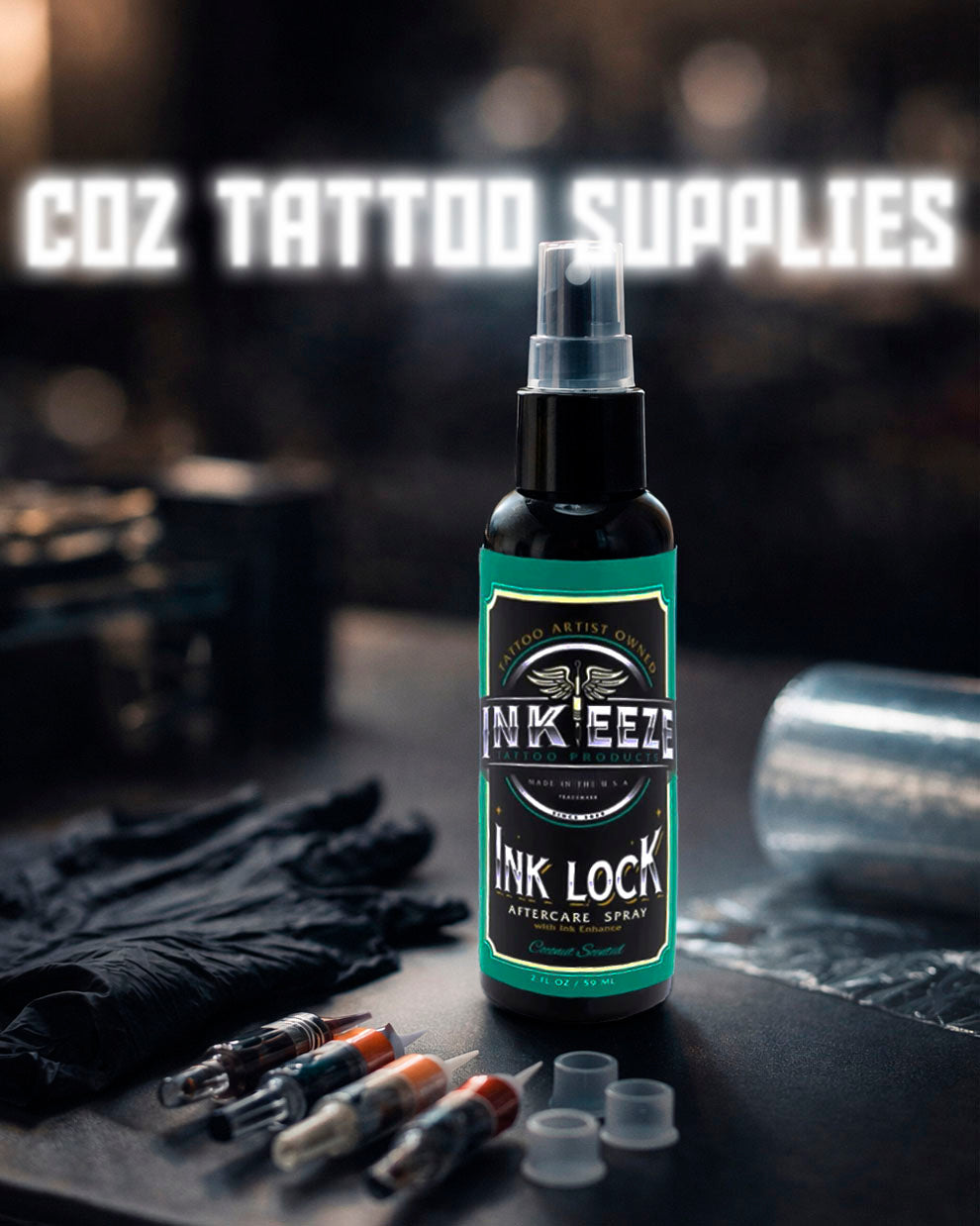 INKEEZE Ink Lock Tattoo Aftercare Spray 2oz displayed on a professional tattoo workstation with gloves and cartridges, available at COZ Tattoo Supplies Canada