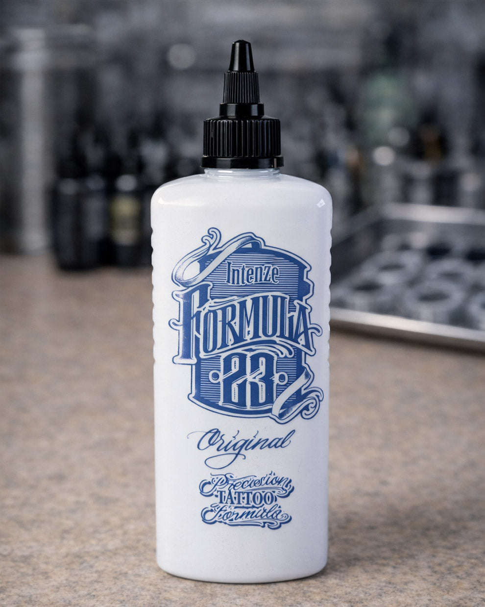 Intenze Formula 23 Original tattoo ink bottle placed on tattoo artist work table