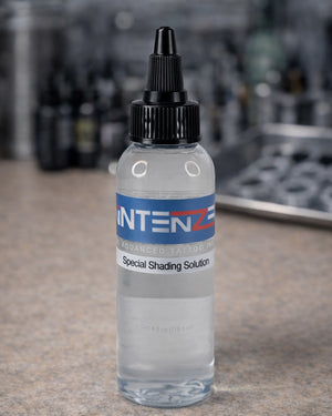 Intenze Special Shading Solution 4 oz bottle on tattoo artist workstation by Coz Tattoo Supplies