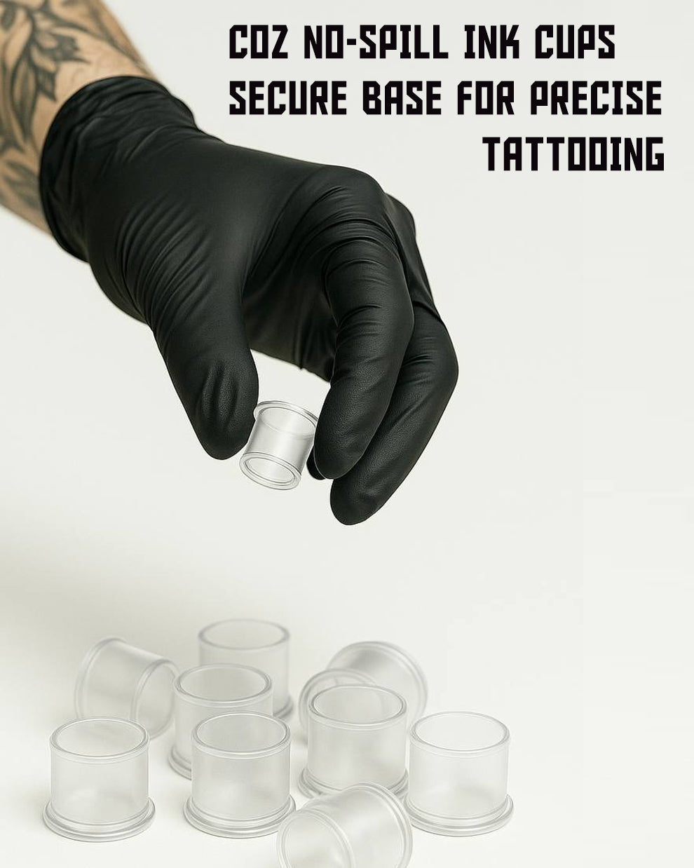 Tattoo artist holding COZ Tattoo Ink Cap with base – anti-spill design for stable ink use, ideal for precise and clean tattooing sessions