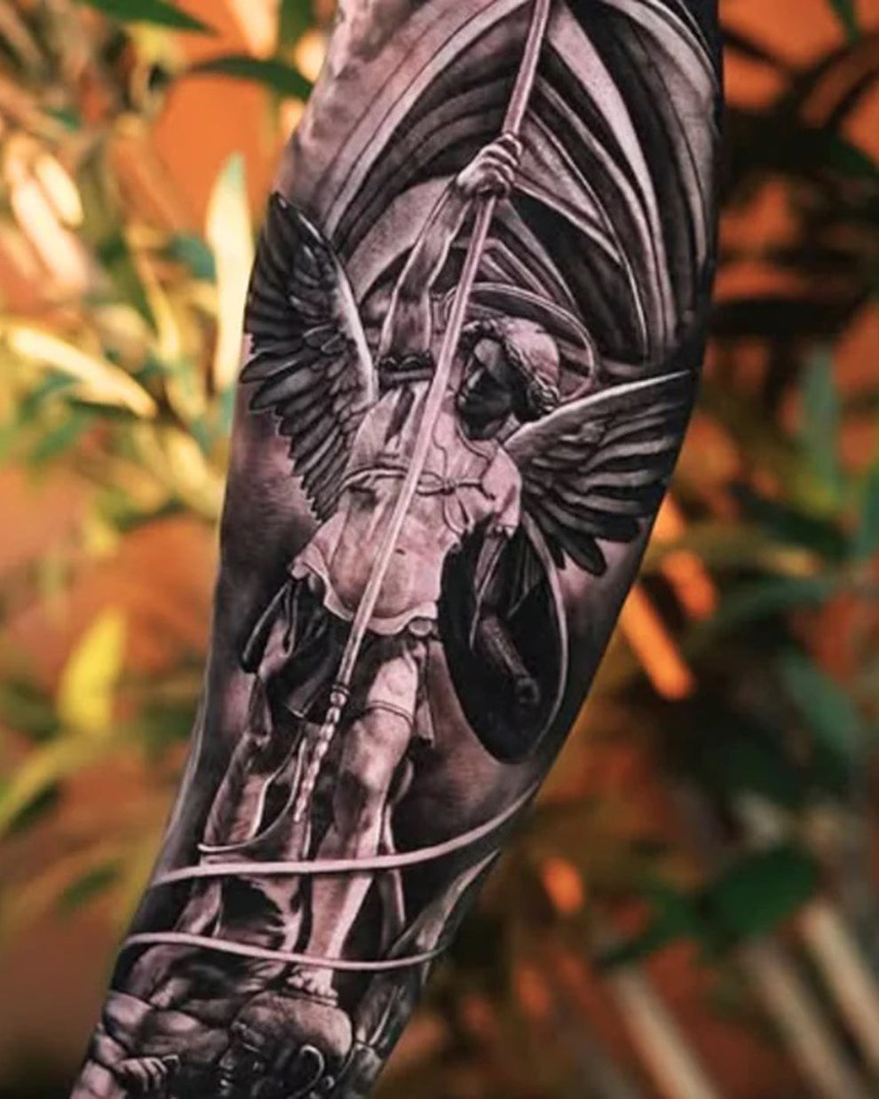 Black and grey Archangel tattoo sleeve created with Intenze True Black Tattoo Ink.