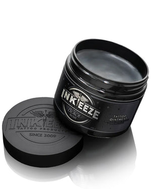 Open jar of INKEEZE Black Tattoo Ointment 150g by COZ Tattoo Supplies Canada, pro tattoo aftercare balm with non-petroleum black glide