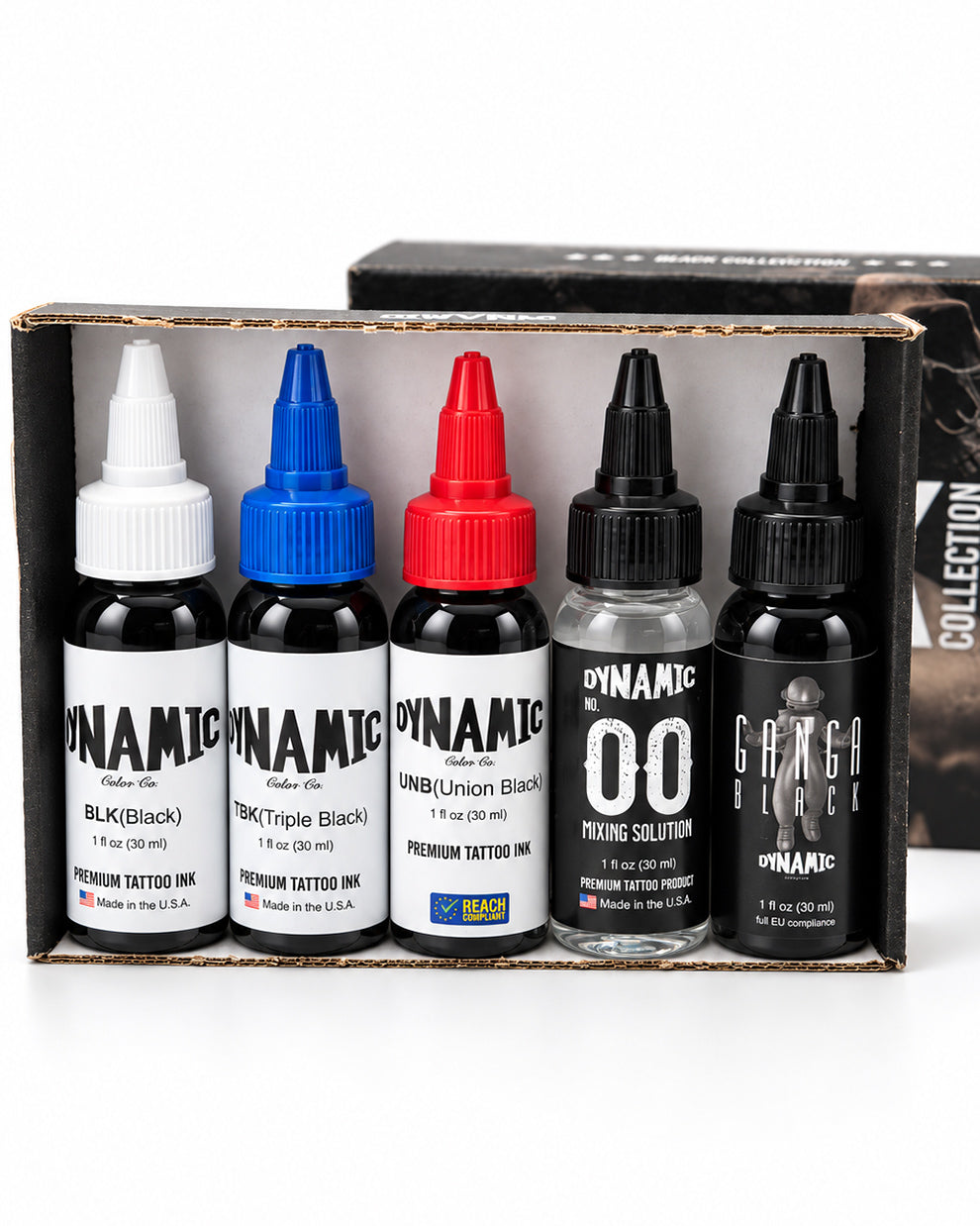 A boxed set of five Dynamic brand tattoo ink bottles displayed in an open black presentation box. The set includes Black, Triple Black, Union Black, Clear, and ganga Black, with white, blue, red, and clear liquid visible in the bottles.