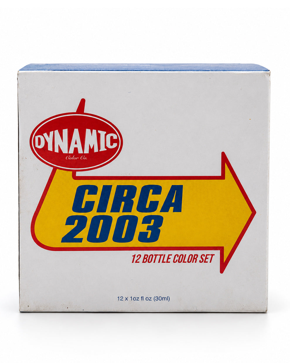 A white cardboard box for a Dynamic Vodka Co. 'Circa 2003' 12-bottle color set, featuring a large yellow arrow and red logo on a white background.