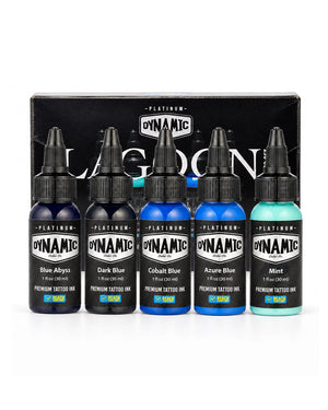 Five bottles of Dynamic Lagoon Platinum tattoo ink arranged in front of their black branded box on a white studio background. The bottles contain Blue Abyss, Dark Blue, Cobalt Blue, Azure Blue, and Mint shades. Each bottle is 1 fl oz (30 ml)