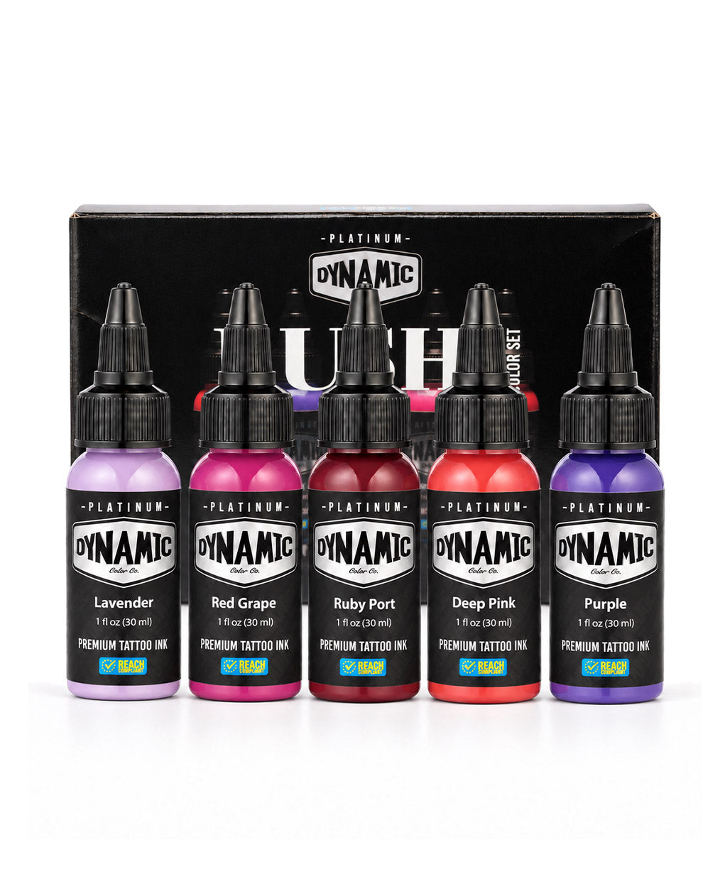 A set of five Dynamic Platinum Lush Premium Tattoo Ink bottles in lavender, red grape, ruby port, and deep pink, purple displayed in front of their black packaging box. Each bottle  is 1 fl oz (30 ml)