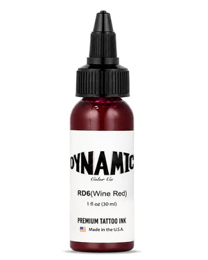 A 1 fl oz (30 ml) bottle of Dynamic Color Co. RD6 (Wine Red) premium tattoo ink, featuring a white label and a black dropper cap, set against a plain white background.