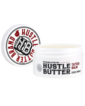 Open jar of Hustle Butter Tattoo Balm Deluxe 5 oz with lid shown, professional tattoo balm available at COZ Tattoo Supplies