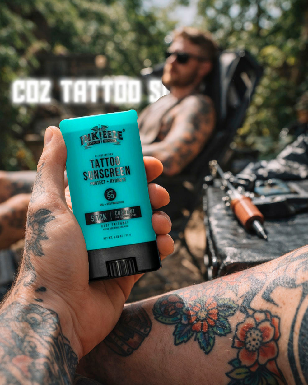INKEEZE Tattoo Sunscreen Stick SPF 50 being held outdoors, protecting tattooed skin during summer, available at Coz Tattoo Supplies