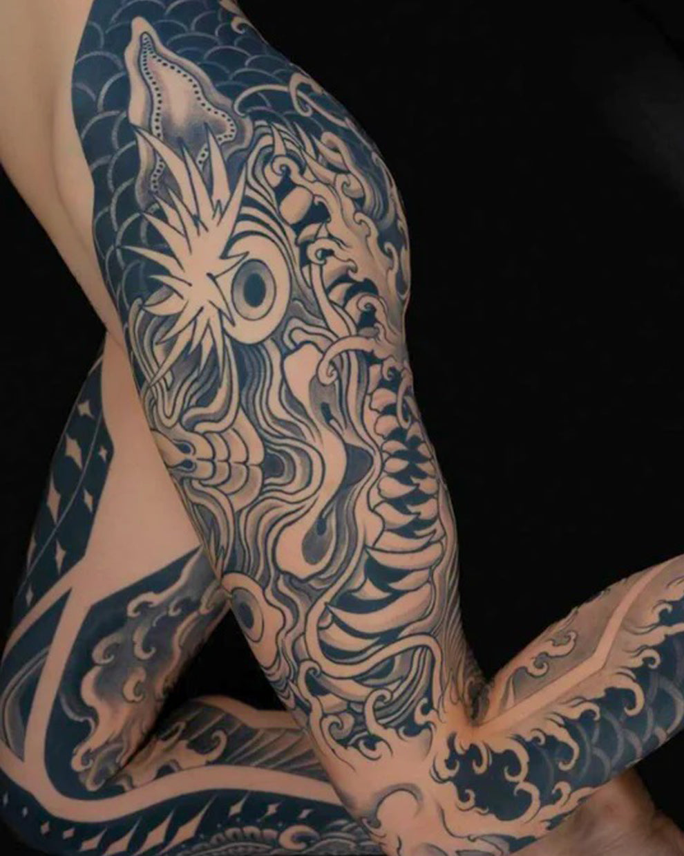 Japanese blackwork full sleeve tattoo featuring bold patterns using Intenze True Black Ink.