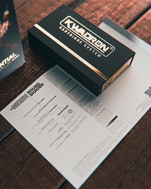 Kwadron Round Shader Essential Pack tattoo cartridges packaging on work desk