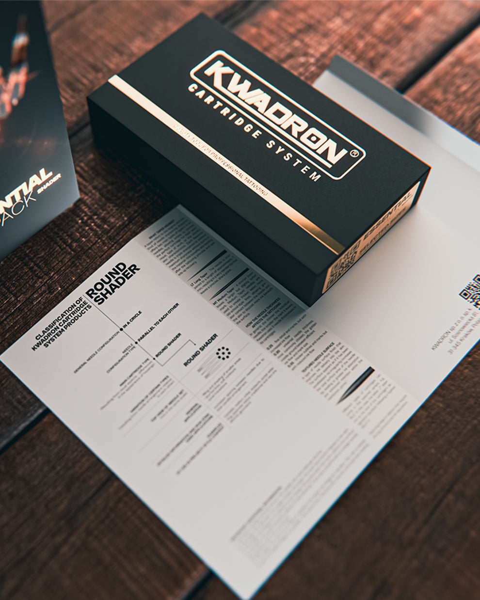 Kwadron Round Shader Essential Pack tattoo cartridges packaging on work desk