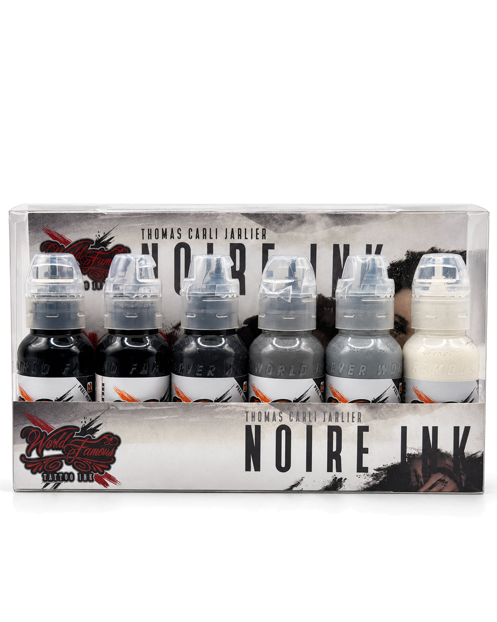 World Famous Thomas Carli Jarlier Noire Ink set in a clear plastic box with six small ink bottles, including five colors: Noire Wash,Rolling Stone,Stonehenge,Battleship Grey,Portrait White,Outlining Ink, on a white background. Each bottle is 1 ozfl (30 ml)
